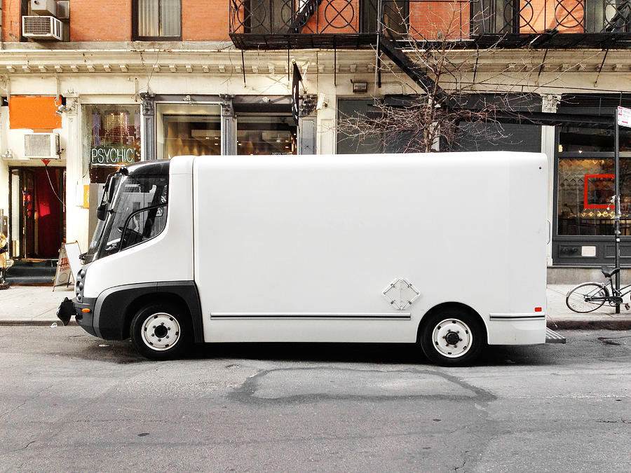 White truck in city street, NYC Photograph by William Andrew