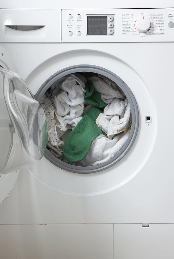 White Washing In Machine One Green Sock Photograph by Martin Poole