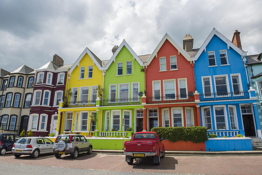 Whitehead, County Antrim, Ulster Region, Northern Ireland, United Kingdom. Colored houses on the waterfront. Photograph by © Marco Bottigelli