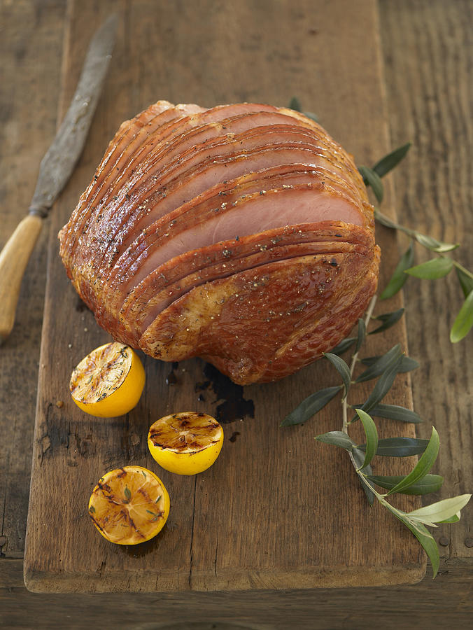 Whole carved ham on cutting board Photograph by Armstrong Studios