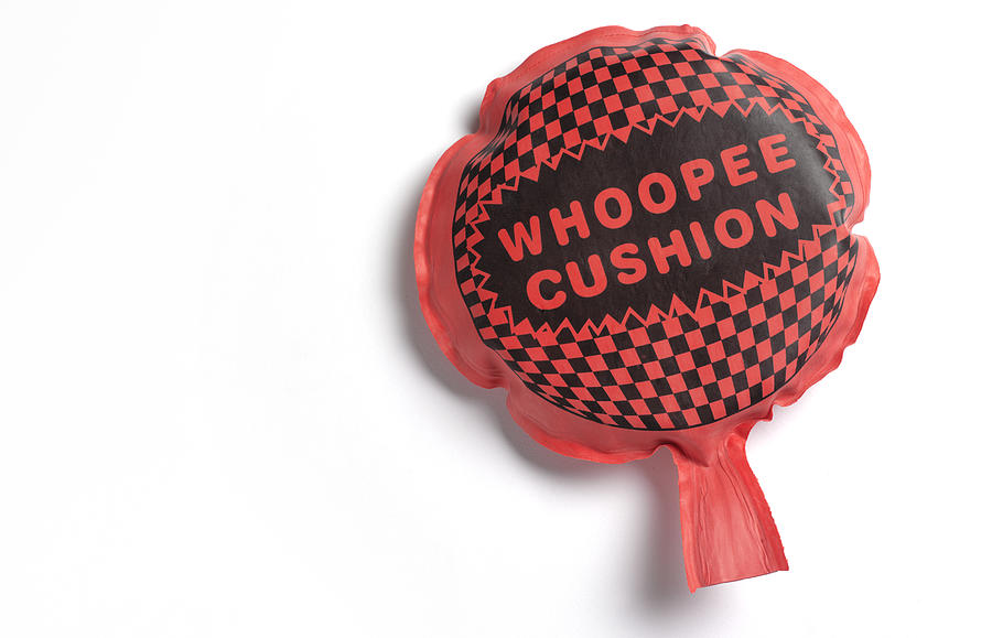 Whoopee cushion with copy space Photograph by Peter Dazeley