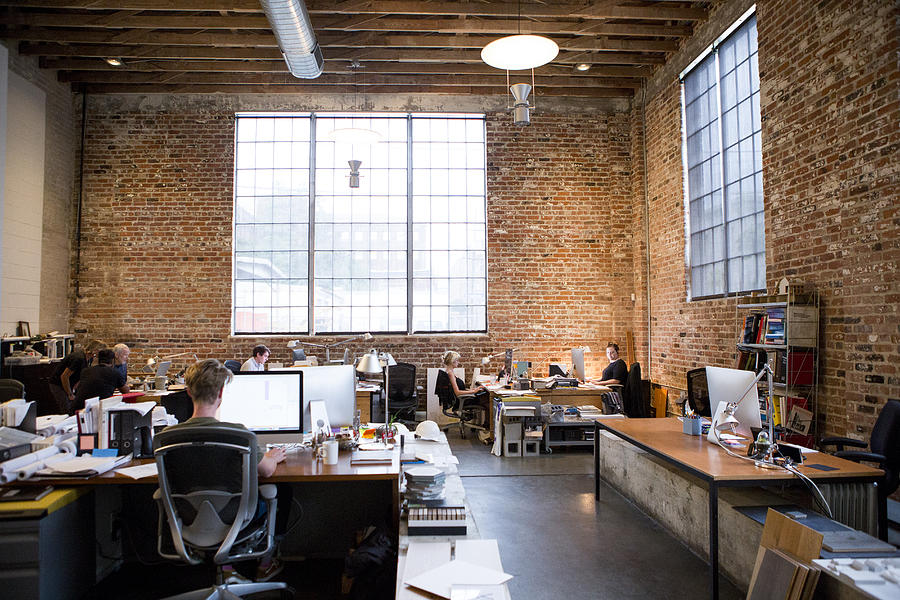 Wide Shot of Architects Office with Brick walls and high ceilings Photograph by Catherine Ledner