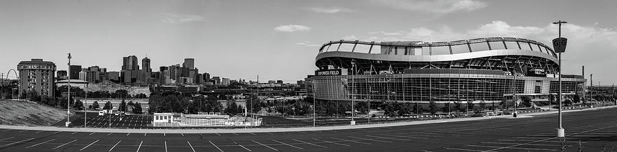 Wide shot of Empower Field at Mile High Stadium with Denver Skyline in black and white Photograph by Eldon McGraw