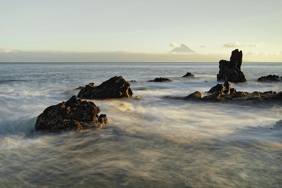 Beach Photograph - Wild coast with mountain silhouette in the evening light by Ralf Lehmann Beach Photograph - Wild coast with mountain silhouette in the evening light by Ralf Lehmann