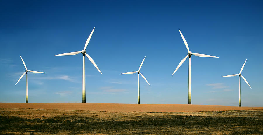 Wind turbine farm on a clear sunny day Photograph by Ola_p
