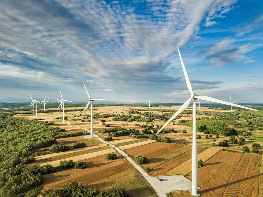 Wind turbines landscape in day light Photograph by Ruben Earth