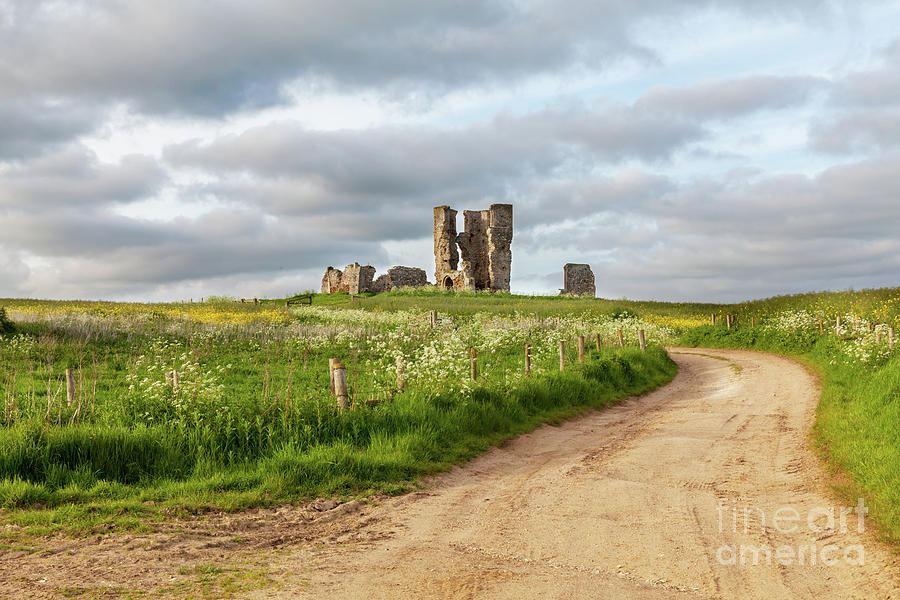 Winding road leading to a chirch ruin in Norfolk Photograph by Simon Bratt