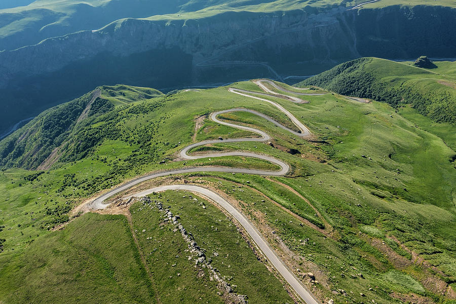 Winding road passing through mountain Photograph by Mikhail Kokhanchikov