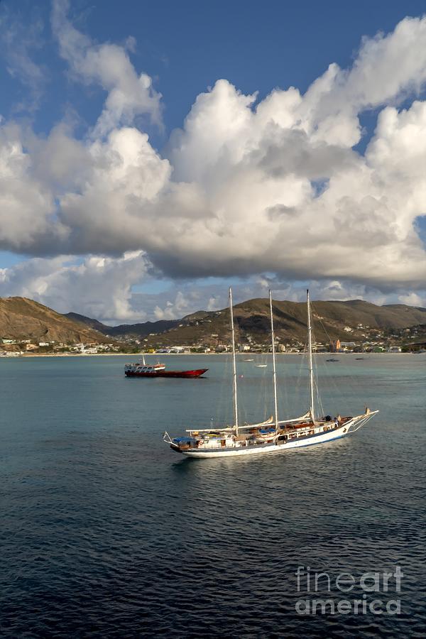 Windjammer sailing ship and other vessels lie anchored in Great Bay at Philipsburg, St Martin Photograph by William Kuta