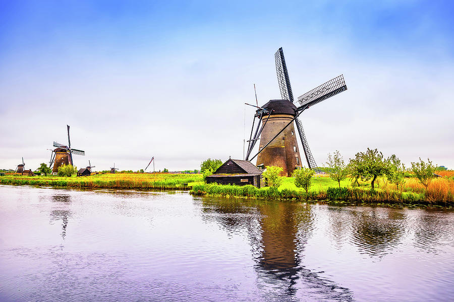 Windmills and canal in Kinderdijk, Holland or Netherlands. Unesc Photograph by Stefano Orazzini