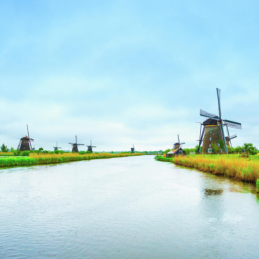 Windmills and canal in Kinderdijk, Holland or Netherlands. Unesco site Photograph by Stefano Orazzini