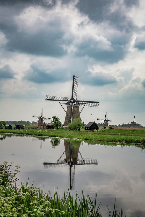 Windmills of Kinderdijk Photograph by John Haldane