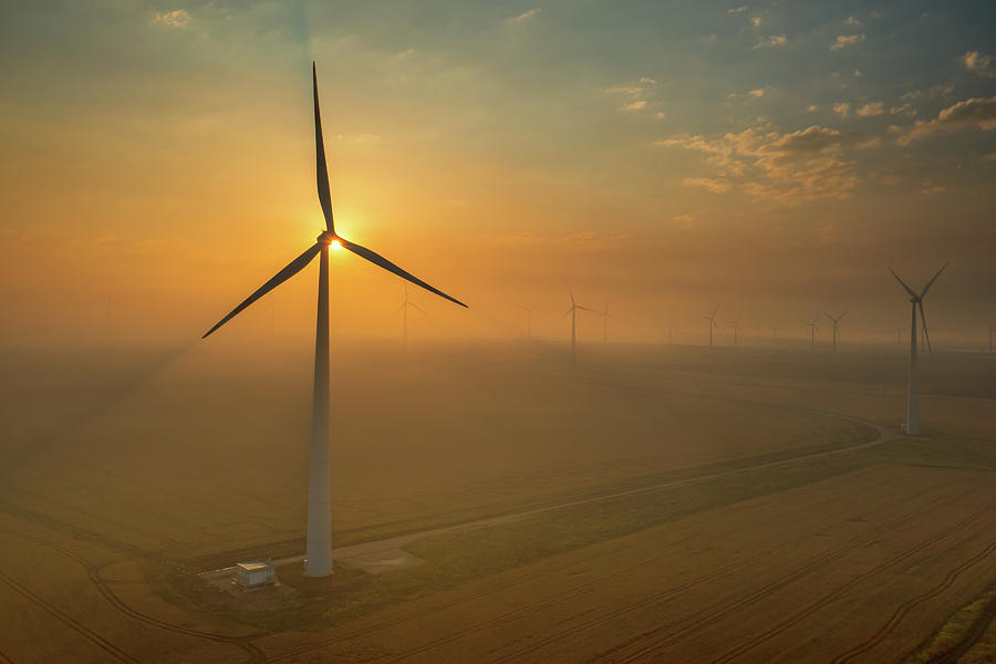 Windmills or wind turbine in sunset light Photograph by Mikhail Kokhanchikov