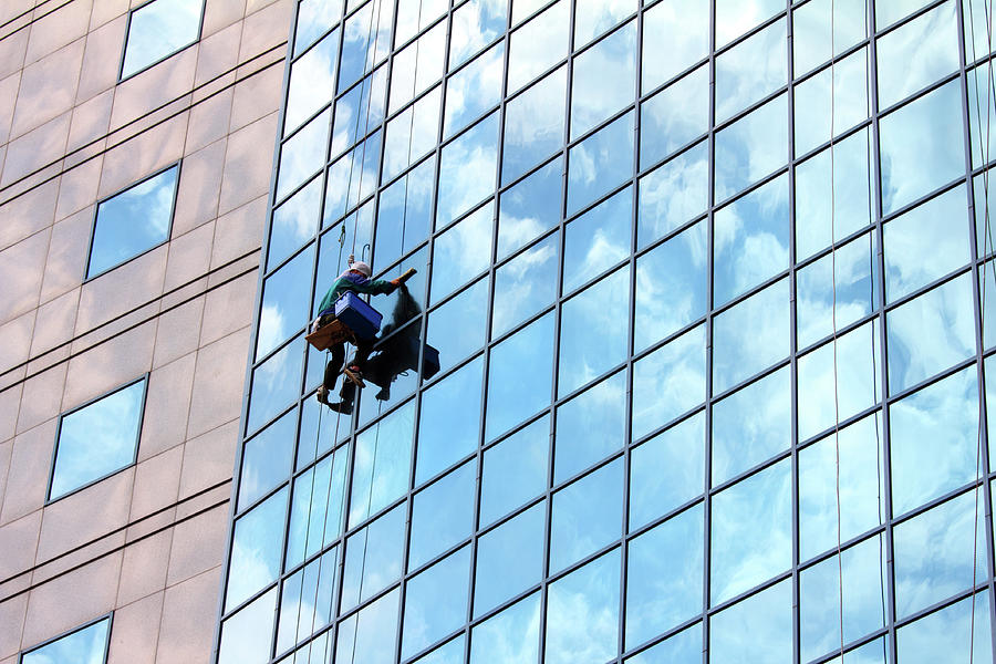 Window Cleaner At Work Photograph by Mikhail Kokhanchikov