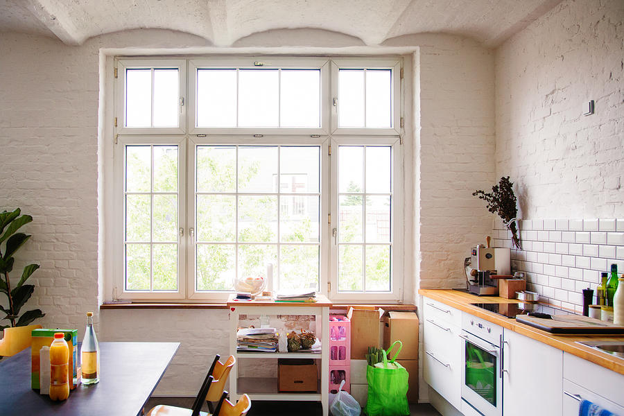 Window into sunny white European kitchen Photograph by NicolasMcComber
