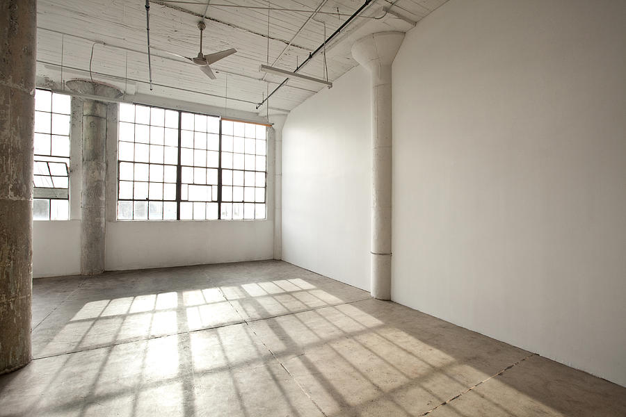 Window shadows in empty loft Photograph by Kyle Monk