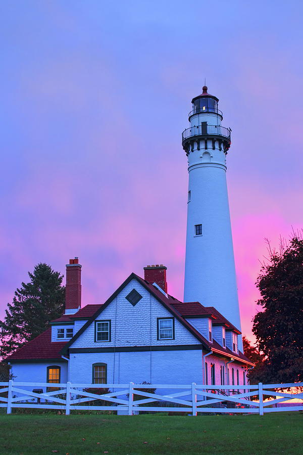 Windpoint Lighthouse Reflecting The Sun Photograph by Dale Kauzlaric