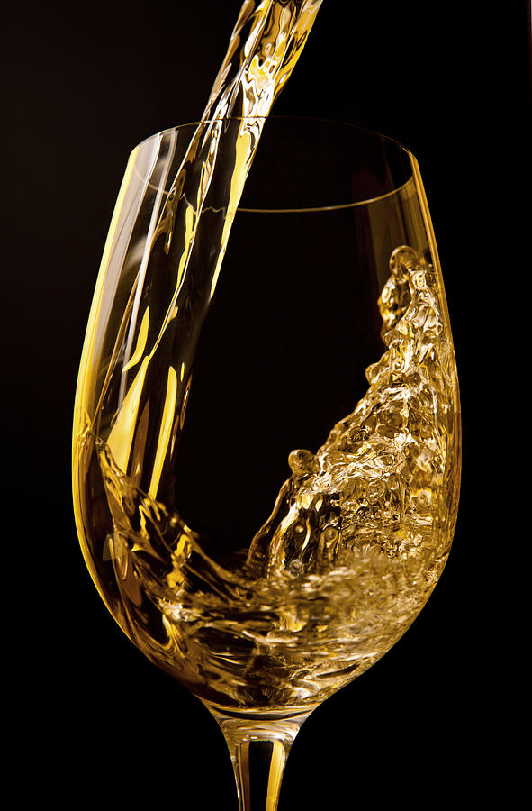 Wine pouring into wine glass Photograph by Nader Khouri