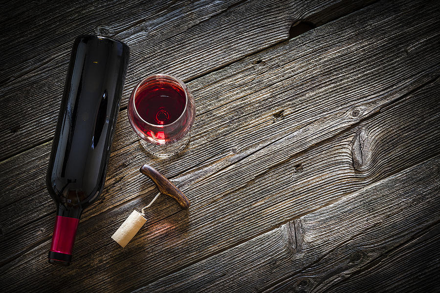 Wineglass, wine bottle, vintage corkscrew and cork stopper Photograph by Fcafotodigital