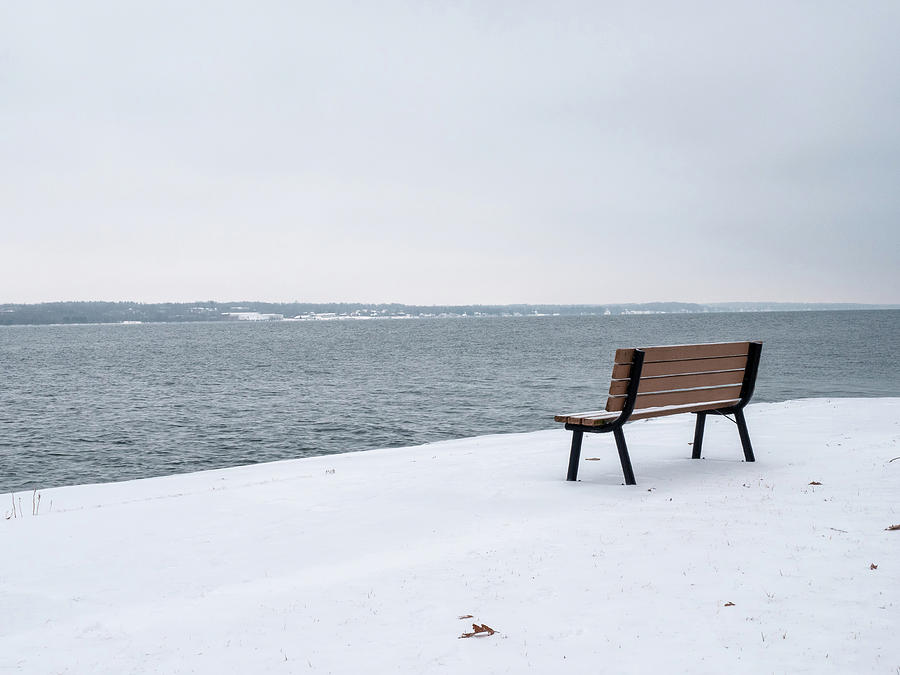 Winter bench on theh St. Lawrence River Photograph by Rob Huntley