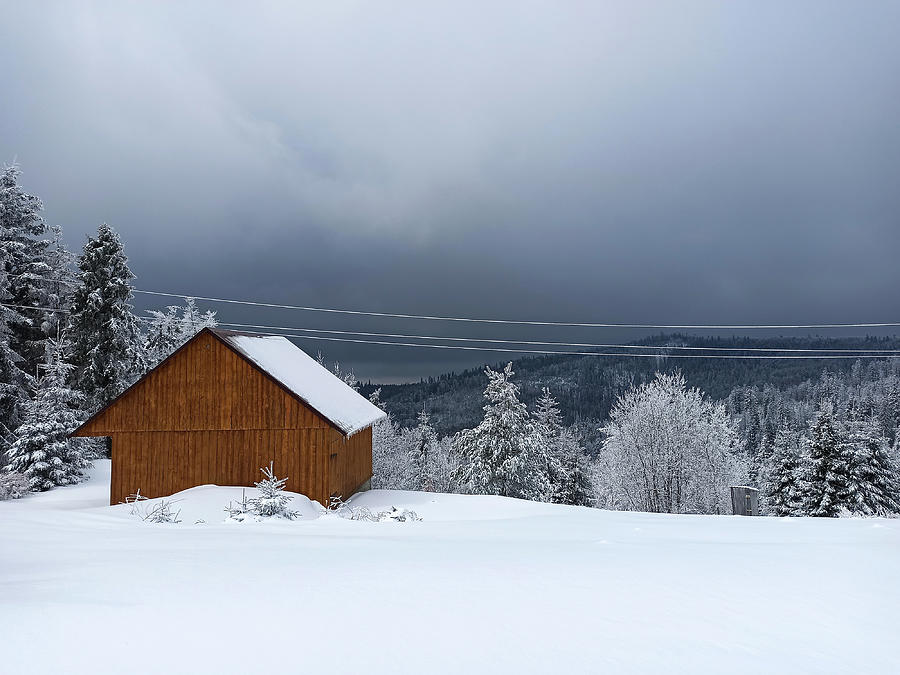 Winter calm mountain landscape with red shed or barn and mount ridge behind polish mountain named turbacz in Poland Photograph by Arpan Bhatia