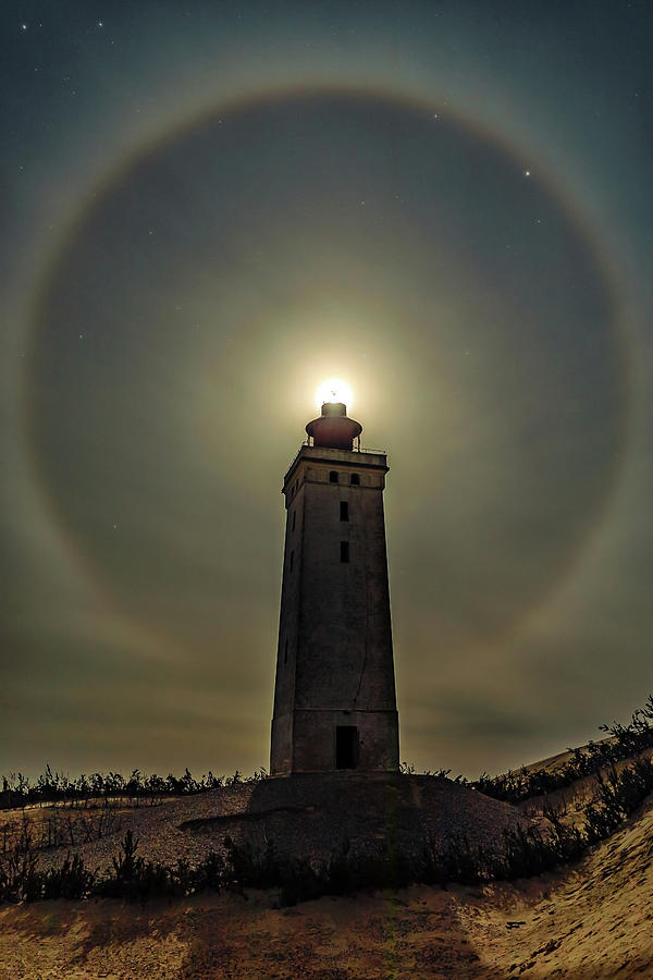 Winter halo lighthouse Photograph by Mike Santis