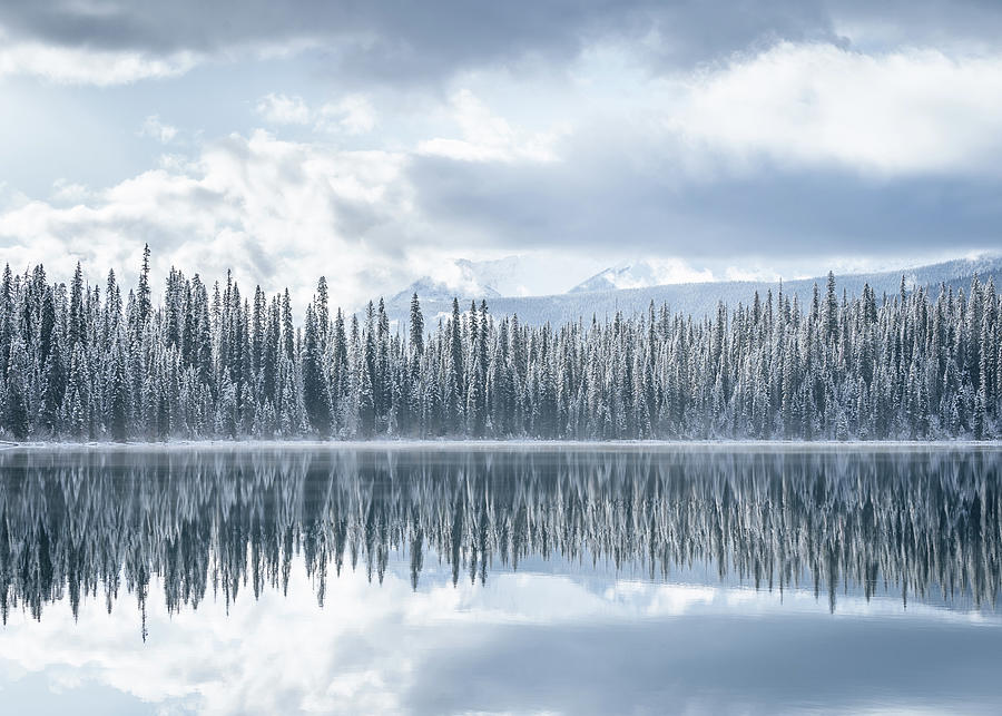 Winter reflections at Emerald Lake in Yoho National Park in Canada Photograph by Peter Kolejak