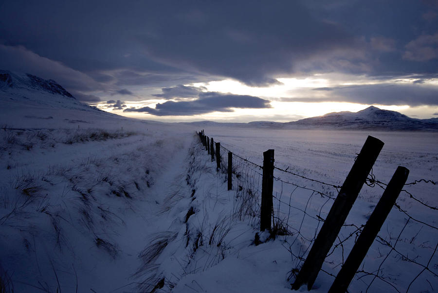 Wire fence beside road in winter Photograph by Vilhjalmur Ingi Vilhjalmsson