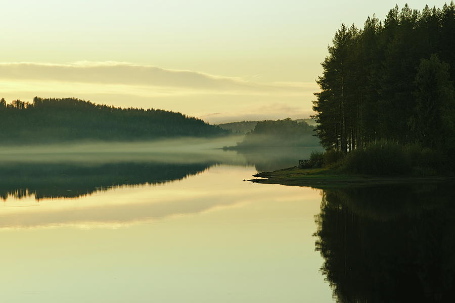 Wisps of haze are rising over an idyllic forest lake at sunset Photograph by Ulrich Kunst And Bettina Scheidulin