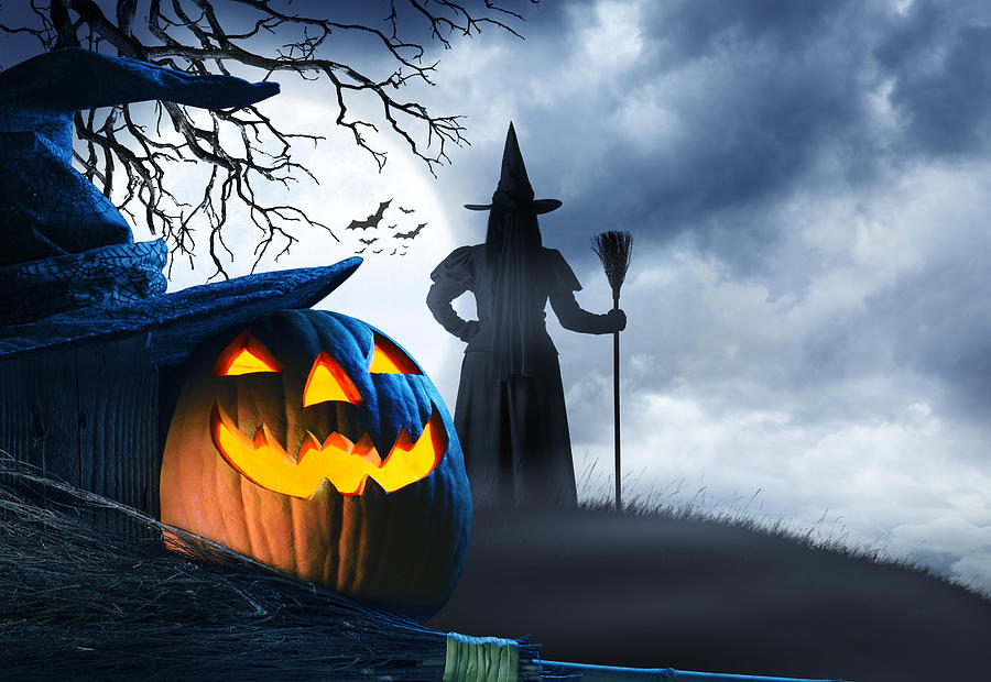 Witch Stands On Small Hill In Front Of Halloween Moon Photograph by Dny59