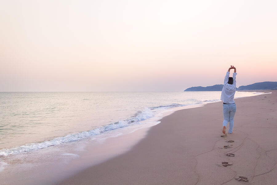 Woman and a Calm Beach in Dawn Photograph by Yuko Yamada