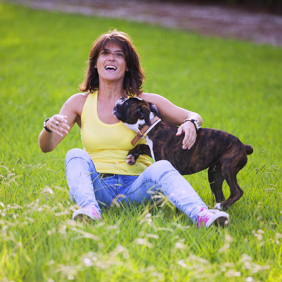 Woman and her boxer dog Photograph by Nphotos