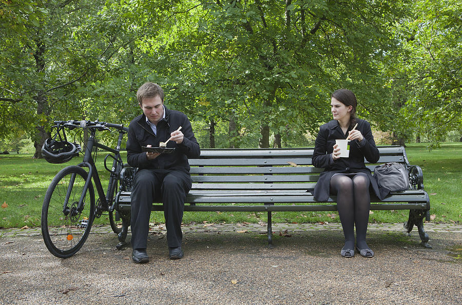 Woman and man eating lunch on park bench Photograph by Clarissa Leahy
