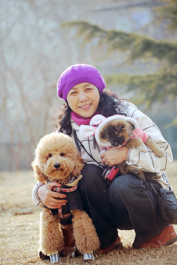 Woman and two dogs Photograph by Photography by Bobi