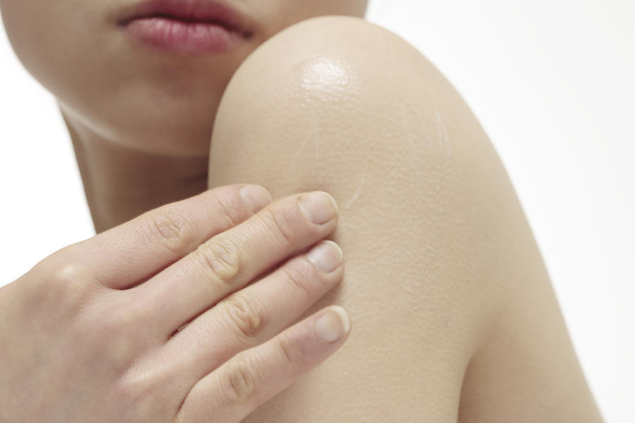 Woman Applying Moisturizer To Body,close-up Photograph by RunPhoto