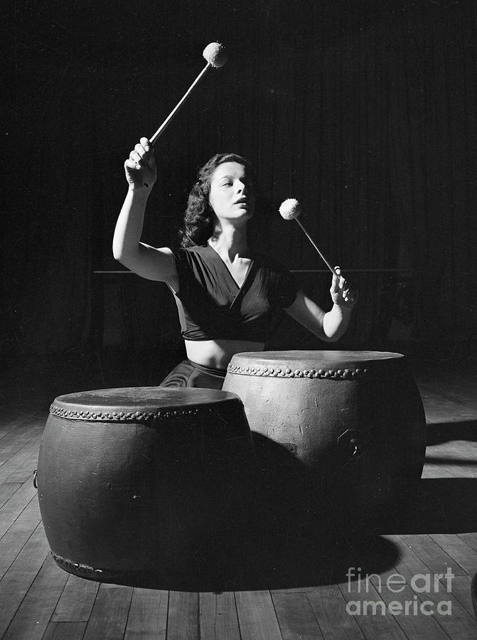 Woman banging drums 1946 Photograph by The Harrington Collection
