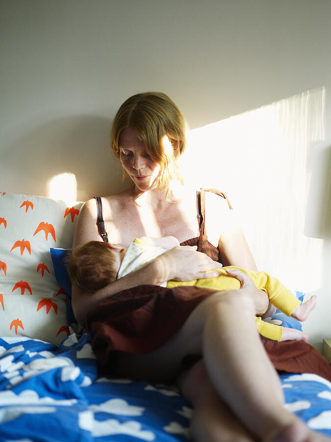 Woman breast-feeding her child Sweden. Photograph by Fredrik Nyman
