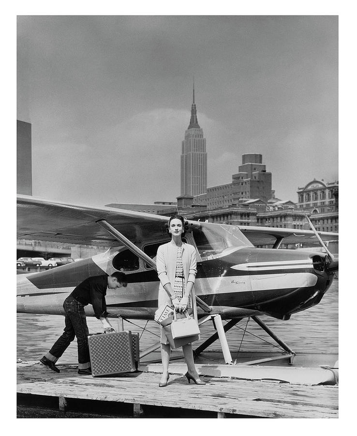 Woman by a Seaplane Photograph by John Rawlings
