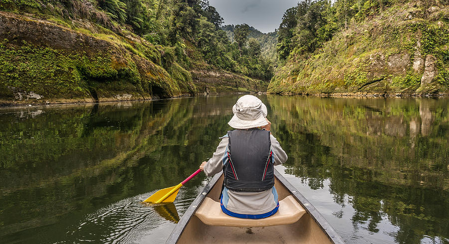 Woman canoeing on river Whanganui, North Island, New Zealand Photograph by Janetteasche
