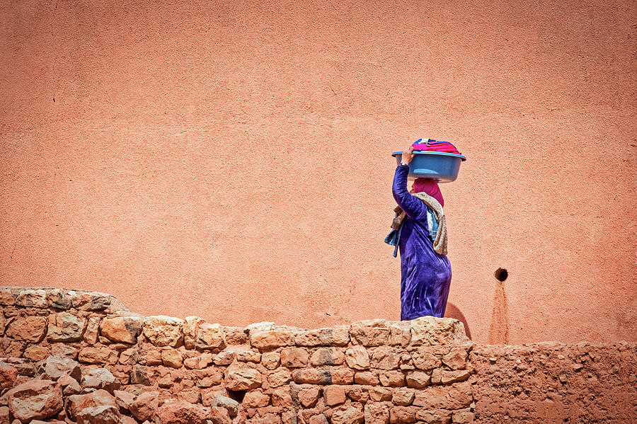 Woman Carrying Laundry - Morocco  Photograph by Stuart Litoff