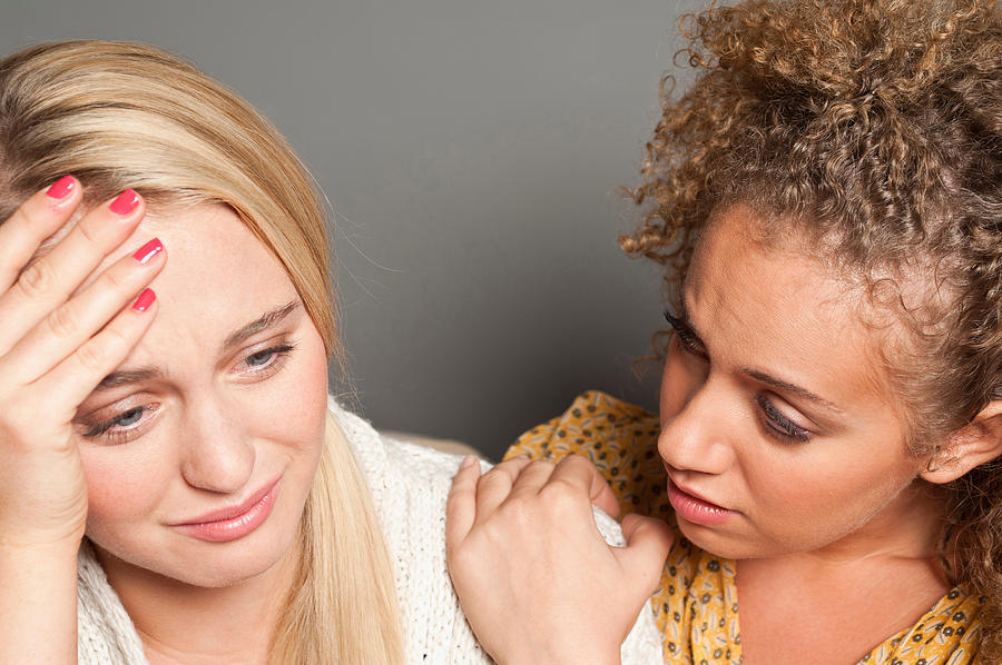Woman consoling friend Photograph by Image Source