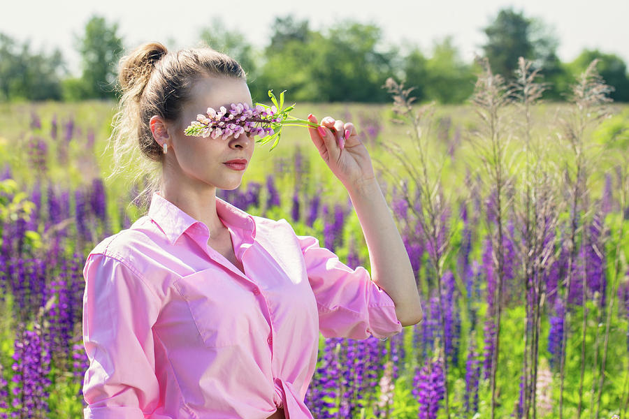 Woman covered her eyes with a flower Photograph by Iuliia Malivanchuk