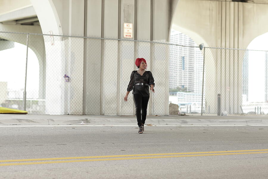 Red Hair Photograph - Woman crossing the street by Felix Mizioznikov