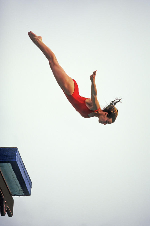 Woman diver flying through the air. Photograph by PCN Photography | Pixels