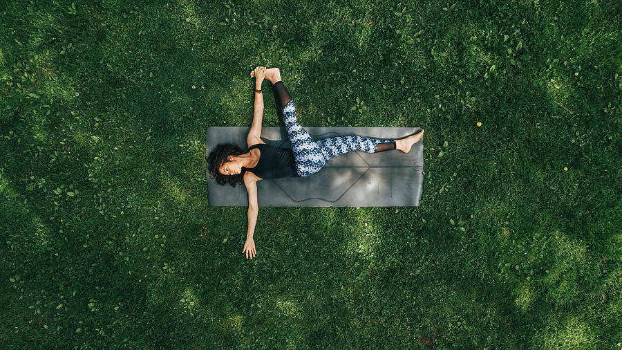 Woman doing Yoga in the Park Photograph by GabrielPevide