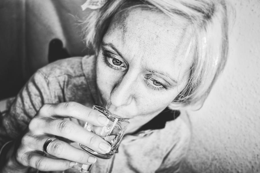Woman drinking a short alcoholic drink Photograph by Mirkic