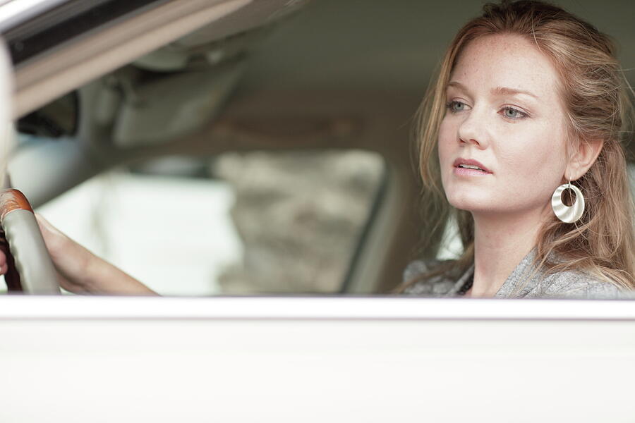 Car Photograph - Woman driver looking into rear view mirror glance by Felix Mizioznikov