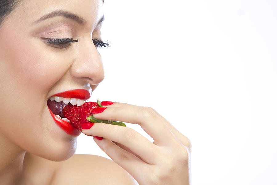 Woman eating a strawberry Photograph by Sudipta Halder Woman eating a strawberry Photograph by Sudipta Halder