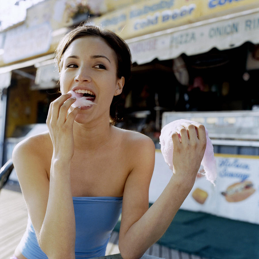 Woman Eating Cotton Candy Photograph by Tony Anderson
