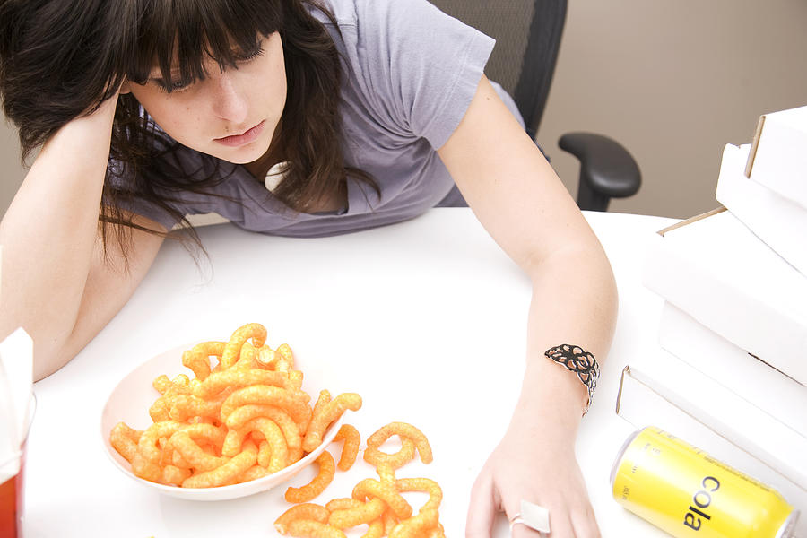 Woman Feeling Guilty After Eating a Lot of Food Photograph by Brainsil